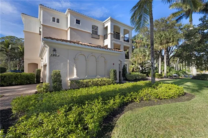 View of home's exterior with a yard
