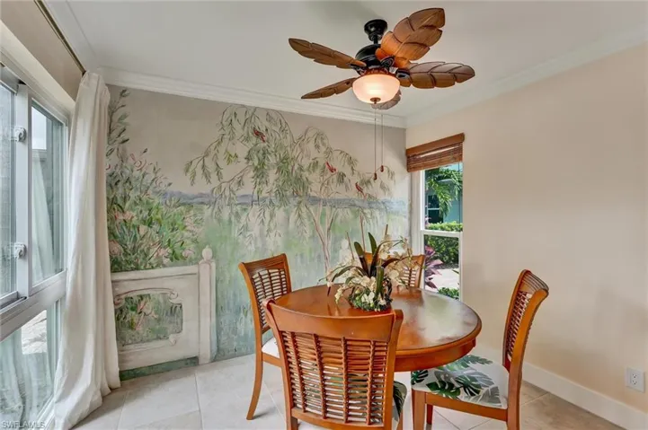 Another view of dining area with mural and another window.