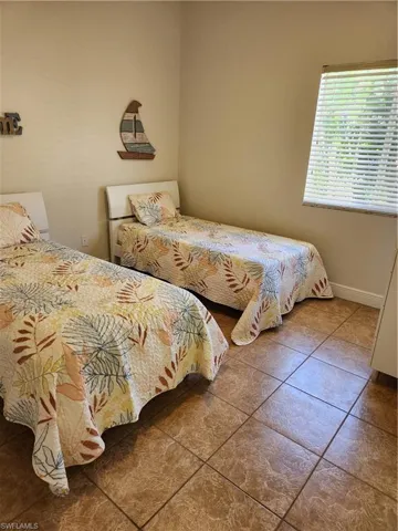 Bedroom featuring baseboards