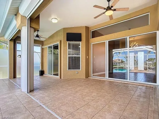 View of patio featuring ceiling fan