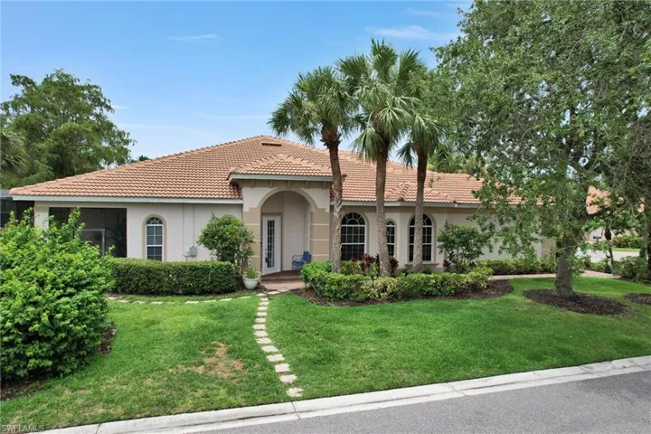 Mediterranean / spanish home featuring a front yard
