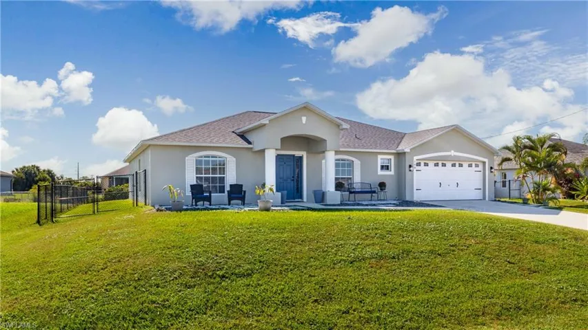 Single story home with stucco siding, concrete driveway, a garage, and roof with shingles