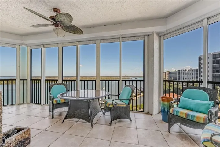 Lanai with fabulous bay views, ceiling fan, tile  floors with Electric shutters