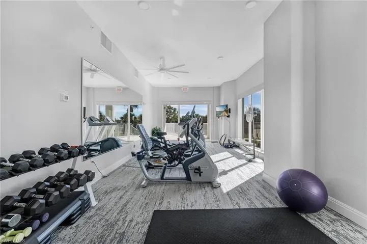 Workout room featuring ceiling fan