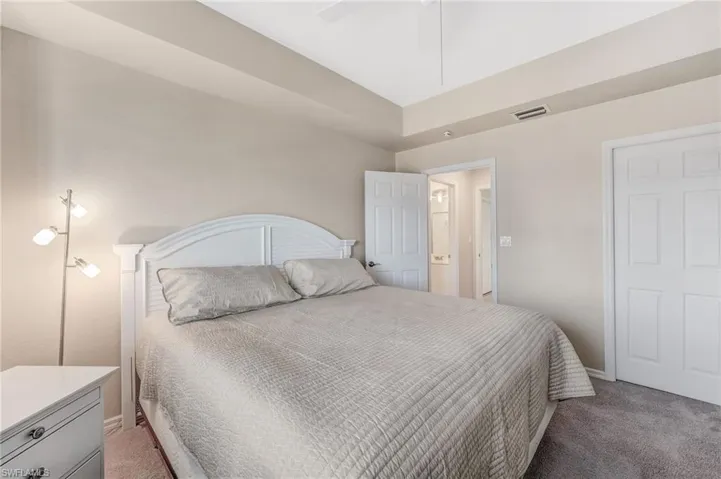 Guest bedroom with carpet and ceiling fan
