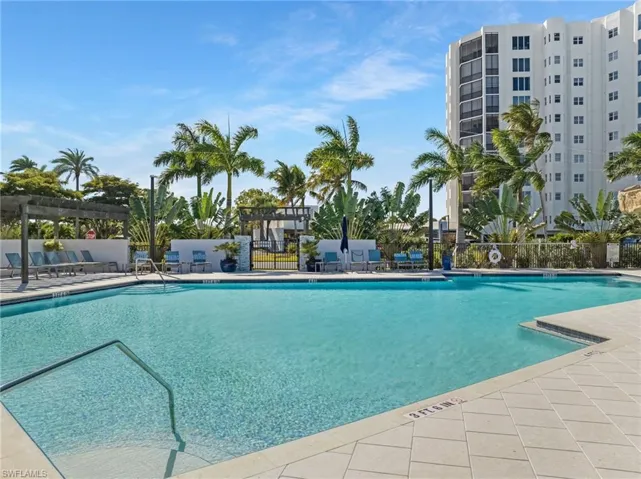 Community pool with a patio