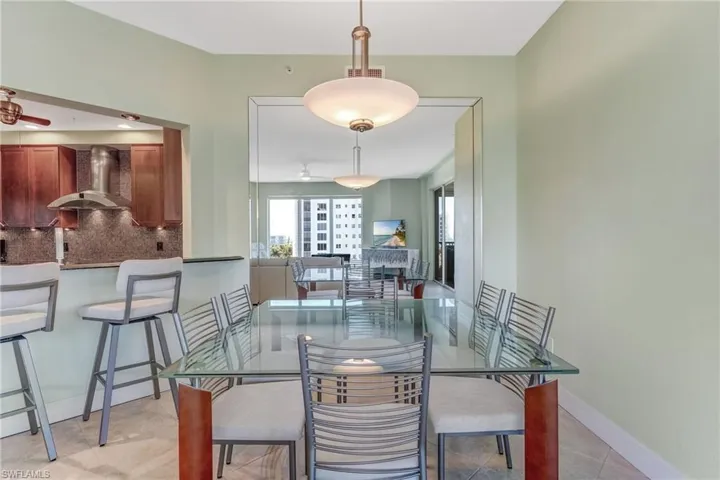 Dining room featuring baseboards and ceiling fan