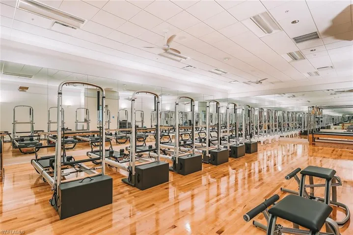 Workout area with light wood-style flooring