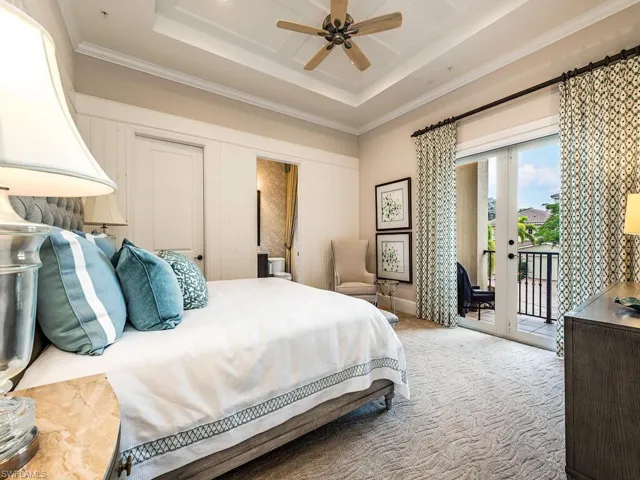 Bedroom with crown molding, carpet floors, access to exterior, french doors, and a raised ceiling