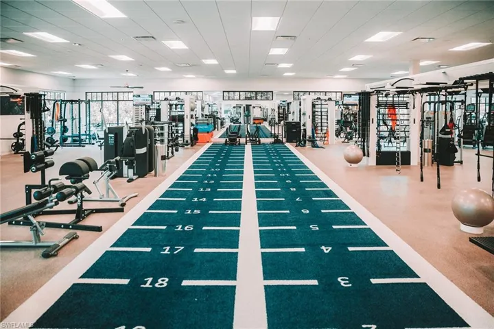 Gym with a paneled ceiling