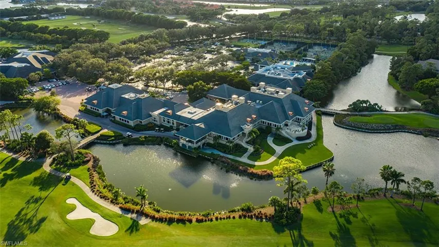 Bird's eye view of a nearby body of water and a golf course