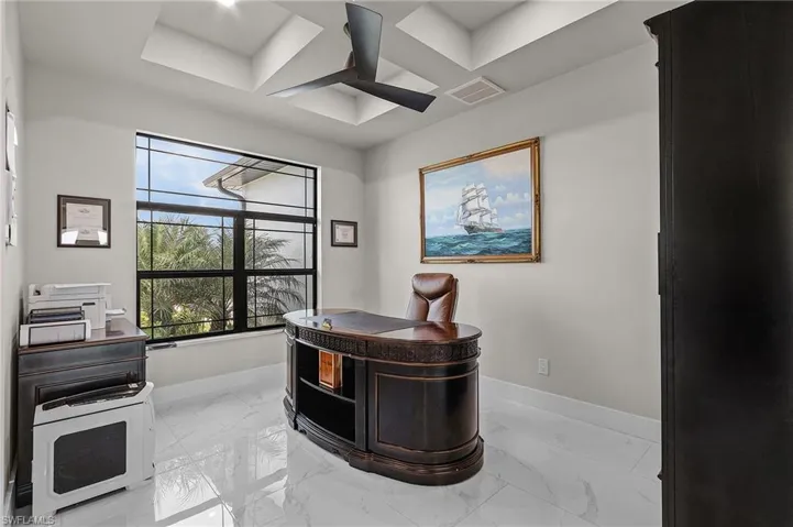 Home office featuring ceiling fan