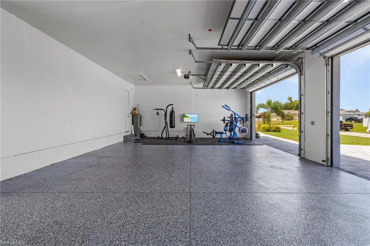 Garage featuring a garage door opener