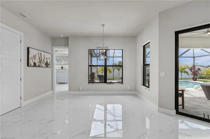 Unfurnished dining area with an inviting chandelier