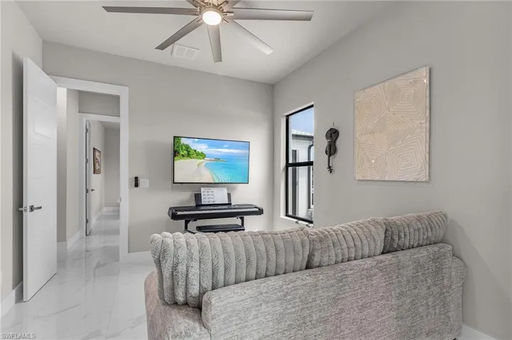 Living room featuring ceiling fan