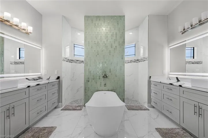 Bathroom with vanity and independent shower and bath