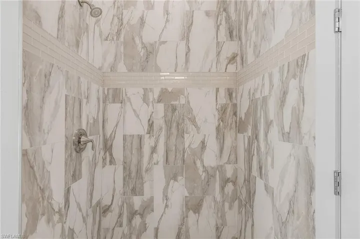 Details with a tile shower