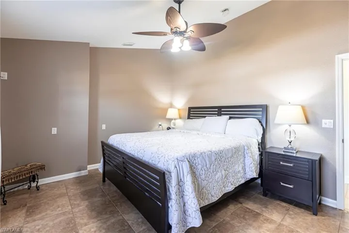 Bedroom with baseboards and ceiling fan