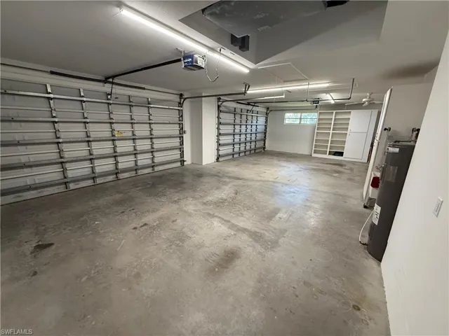 Garage with a garage door opener and water heater