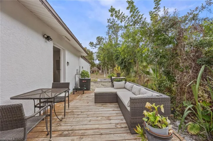 Wooden terrace featuring outdoor seating