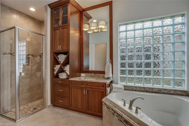 spa-like model view bath. custom moldings w/ built-ins