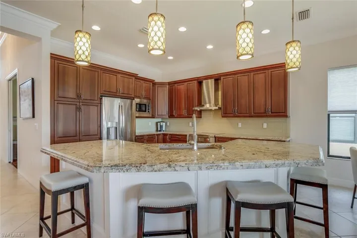 gourmet kitchen with Wolfe induction range, Monogram hood, Miele dishwasher,