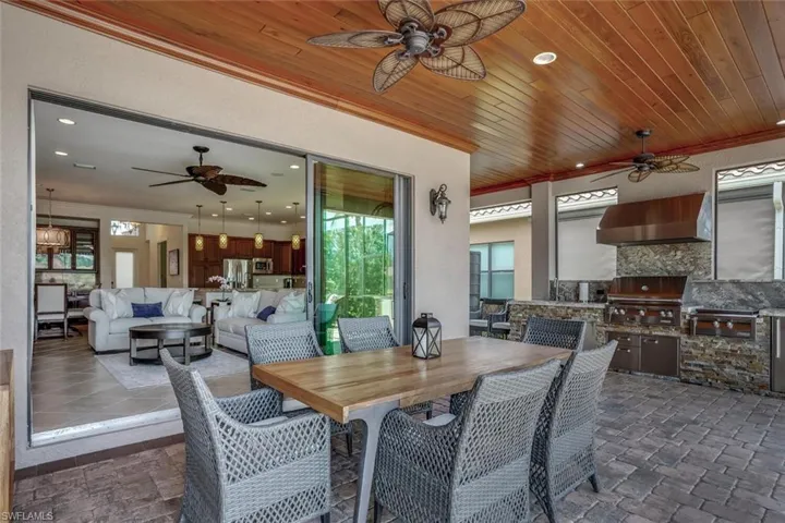 OUTDOOR DINING WITH HIGH END summer kitchen