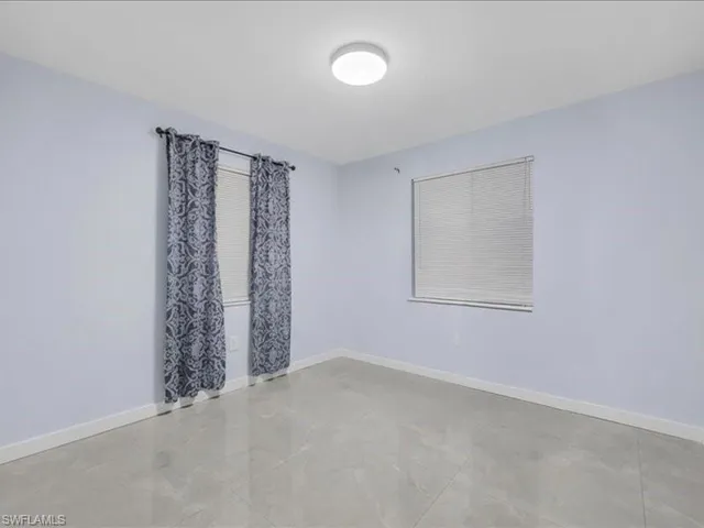 Empty room with baseboards