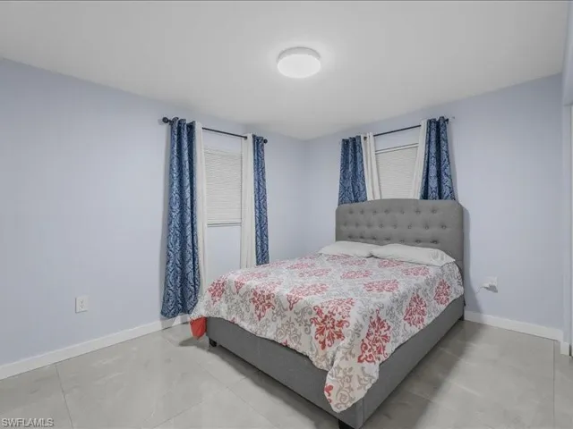 Bedroom featuring baseboards