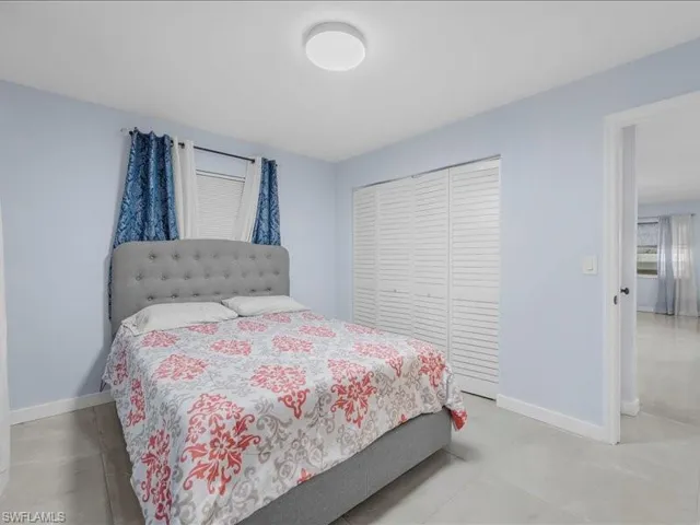 Bedroom with baseboards and a closet