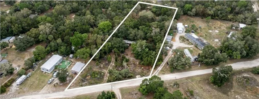 Expansive wooded land parcel featuring mature trees and a natural landscape
