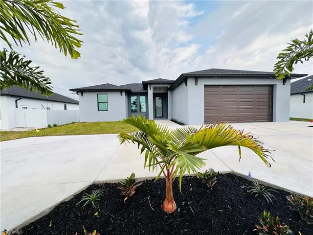 View of front of property with a garage