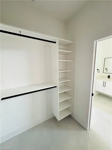 Spacious closet featuring a sink