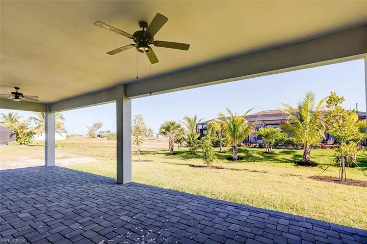 View of patio featuring a ceiling fan