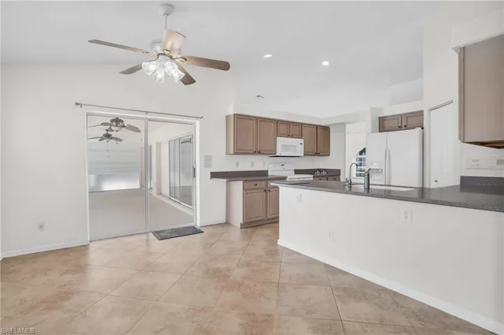 Kitchen with sliders opening to lanai