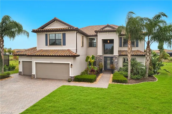 Featuring a front yard and a garage