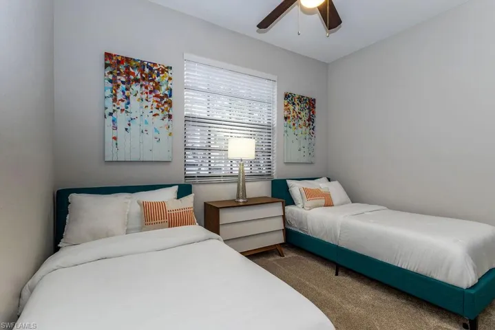 Bedroom with carpet flooring and ceiling fan