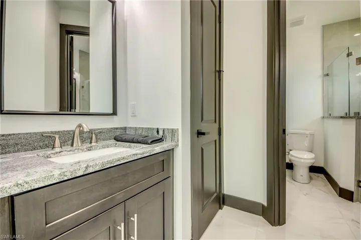 Jack and Jill style ensuite bathroom- with extra vanity- with marble and granite finishes