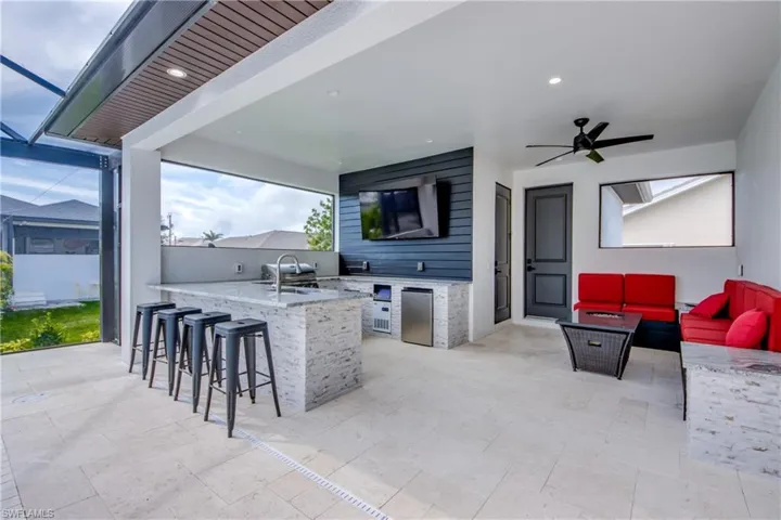 View of second under truss seating area connected to the outdoor kitchen