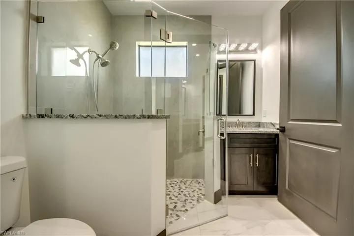 Jack and Jill style ensuite bathroom- with extra vanity- with marble and granite finishes