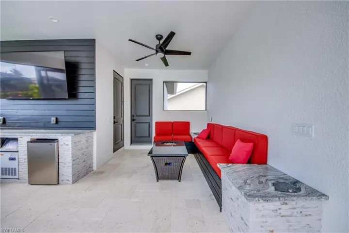 outdoor seating area connected with to the outdoor kitchen