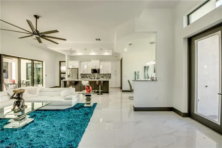 Our Great room view- featuring marble flooring- custom built in features all with gorgeous views - of our 18 ft wide sliders