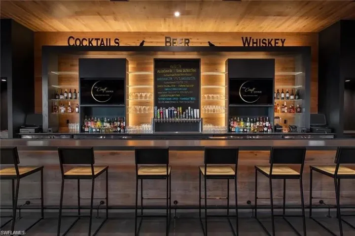 Bar with wooden ceiling and a bar