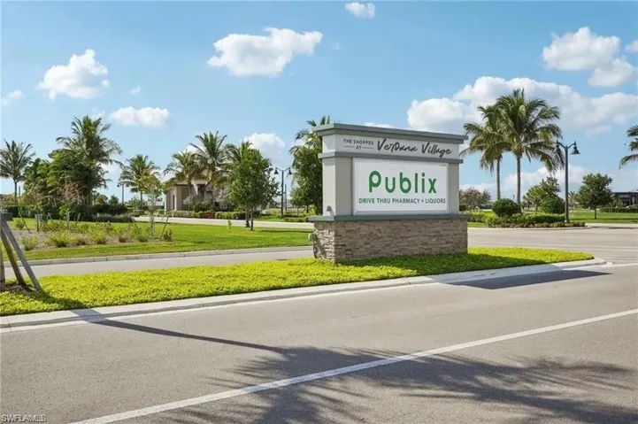 Community / neighborhood sign with a lawn