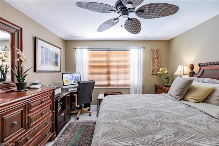 Master bedroom has pool and lake views.