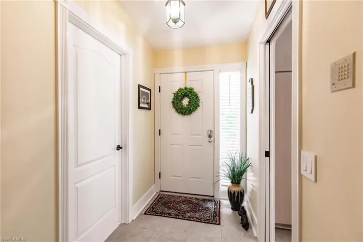 Entryway featuring light tile floors
