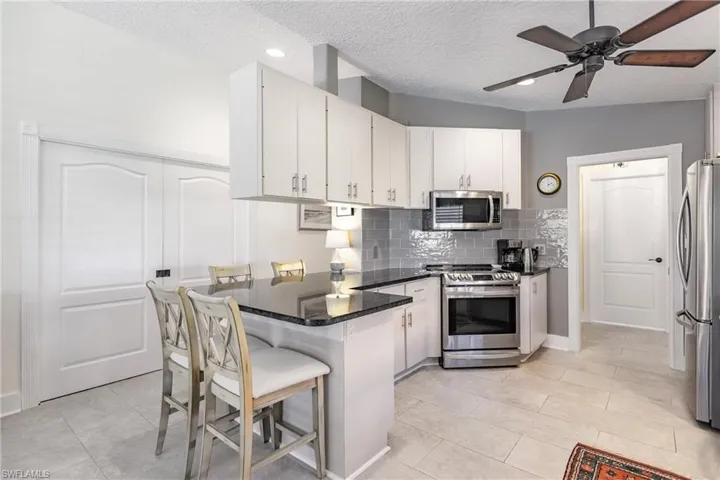 Kitchen view with Den doors closed.
