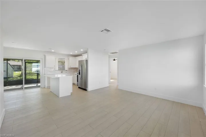 Unfurnished living room featuring light hardwood / wood-style flooring