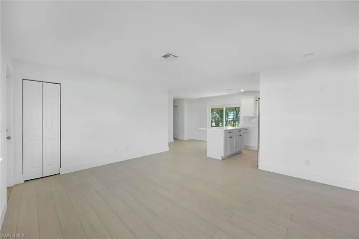 Empty room featuring light wood-type flooring