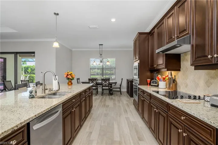 Dining Area Open to Kitchen with Pool View